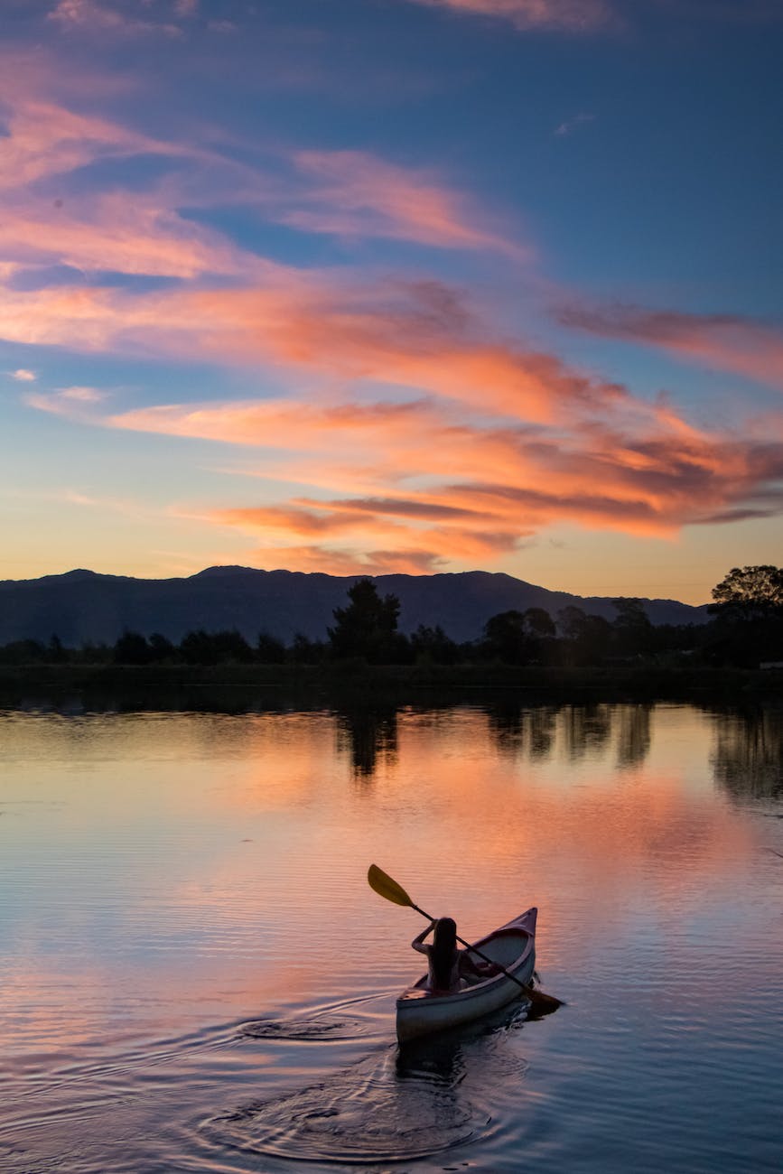 Silhouette of person kayaking